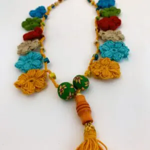 Colorful crochet necklace with tassel detail.