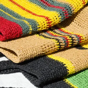 Colorful woven bags with striped patterns.
