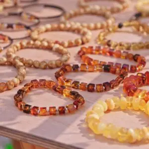 Assorted beaded bracelets displayed on a table.